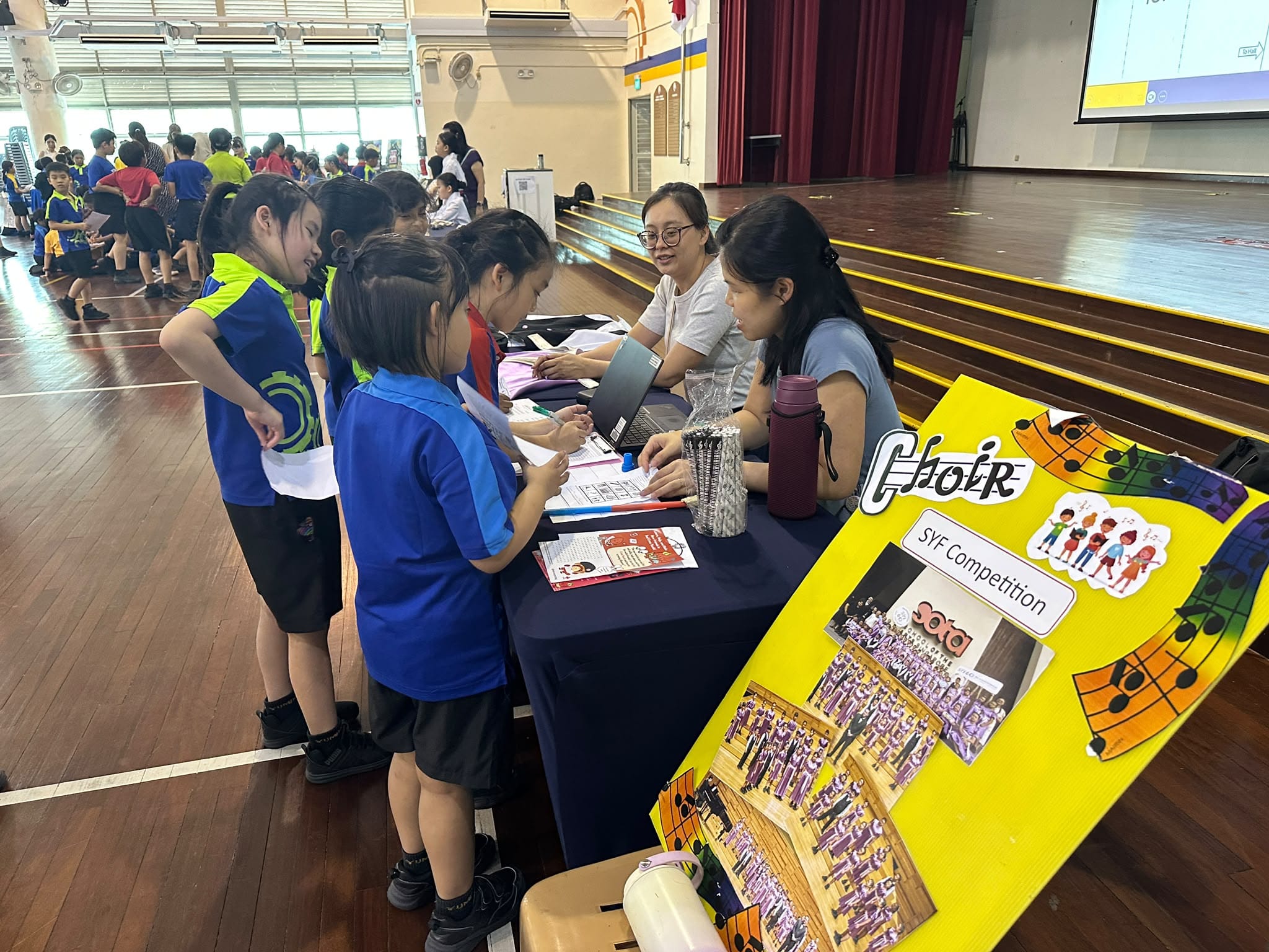 Students looking at the choir booth